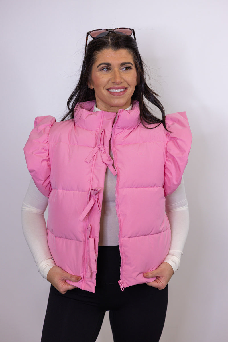 pink puffer bow detail vest