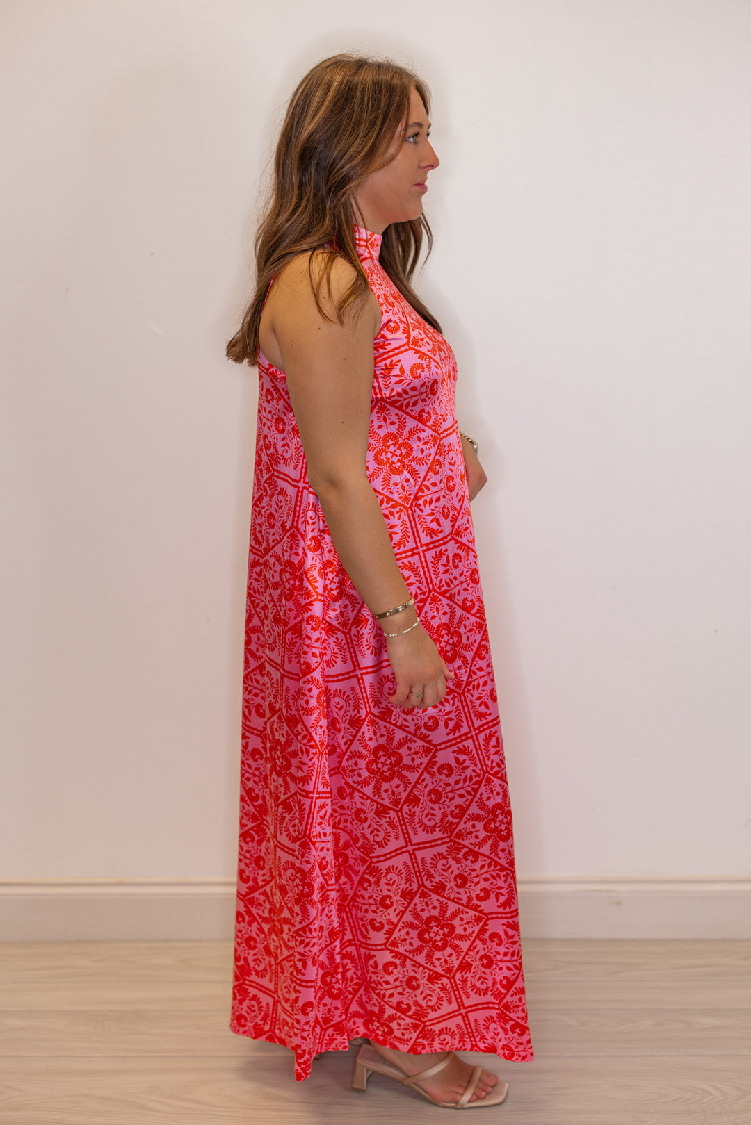 Women's pink and red floral print halter maxi dress by Karlie showing full side view