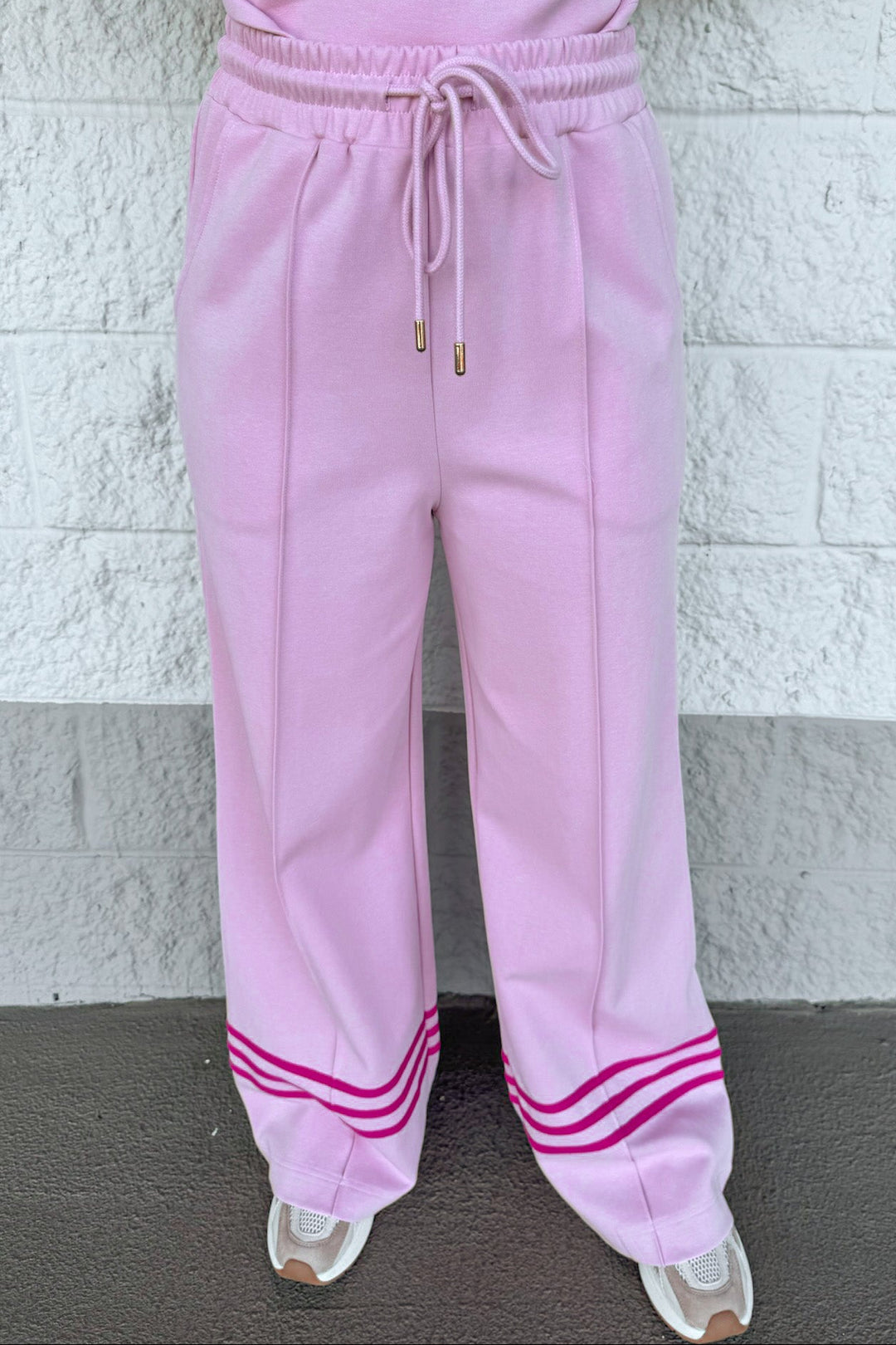 light pink with hot pink stripes at hem drawstring elastic waist wide leg knit pants