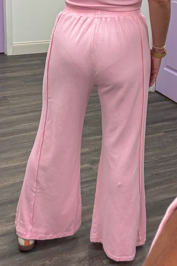 light pink ribbed knit tank top and terry knit palazzo pants matching athleisure set