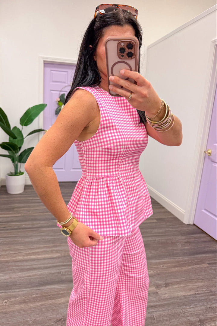 pink and white checkered gingham sleeveless crew neckline peplum top