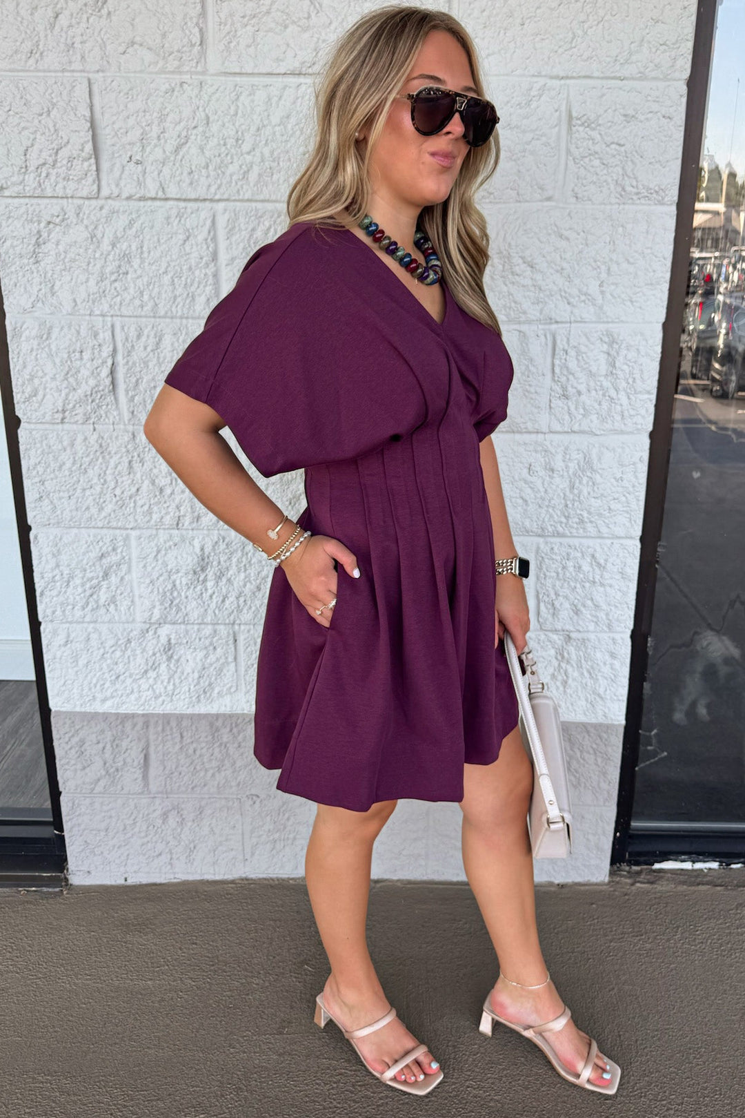 solid plum dolman sleeve v neckline pleated short dress with pintuck details and side pockets