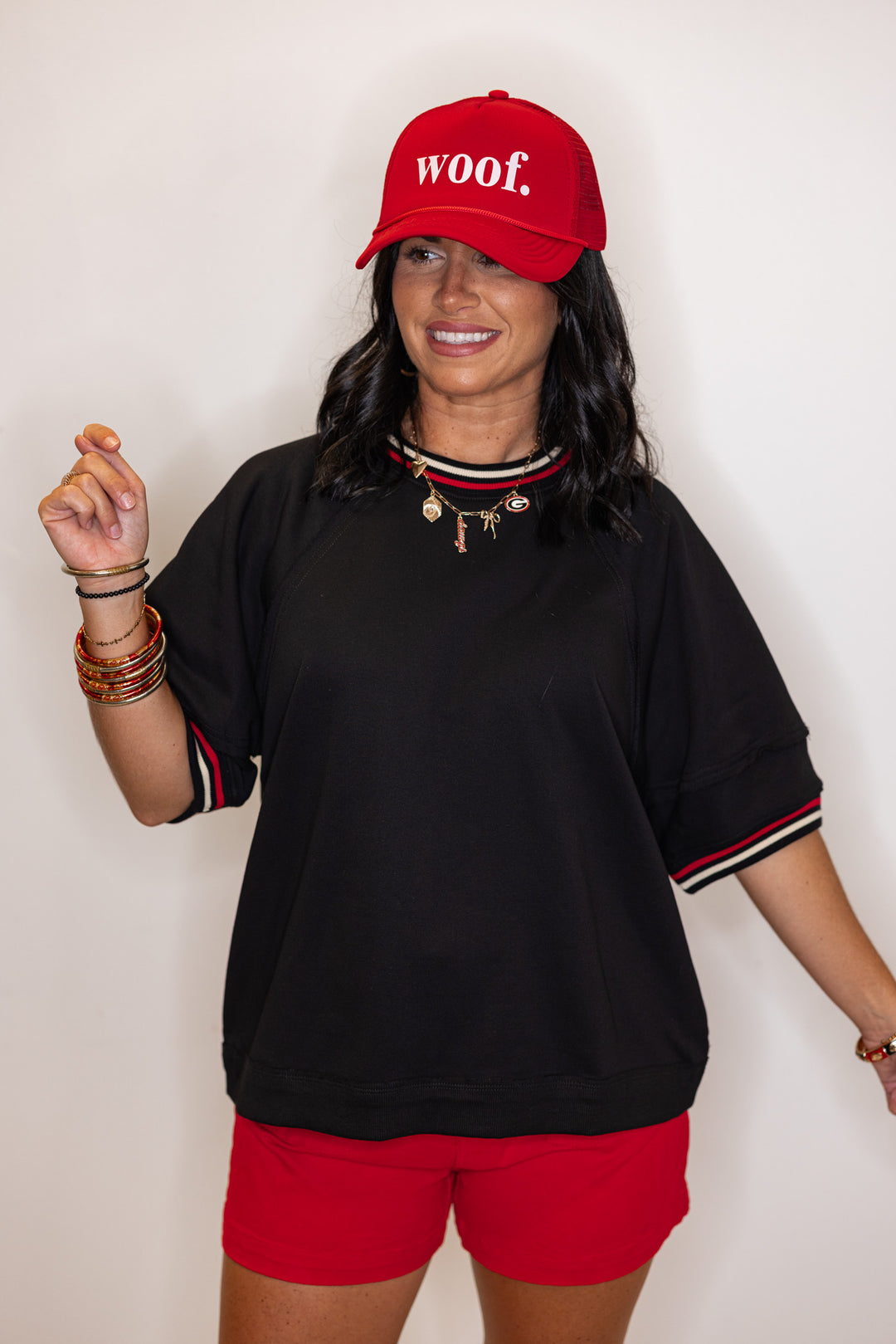 Women's black french terry knit top with cream and red striped trim by Entro