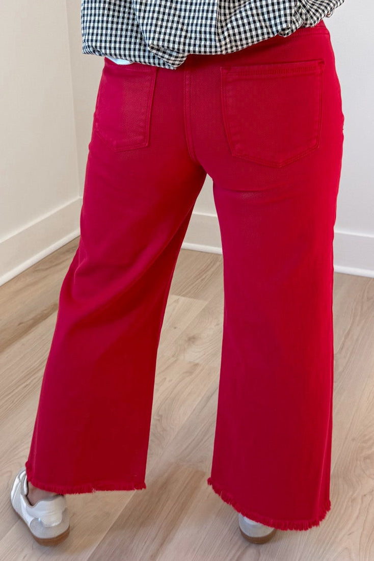 solid red denim high rise cropped wide leg frayed hem tummy control jeans with back pockets