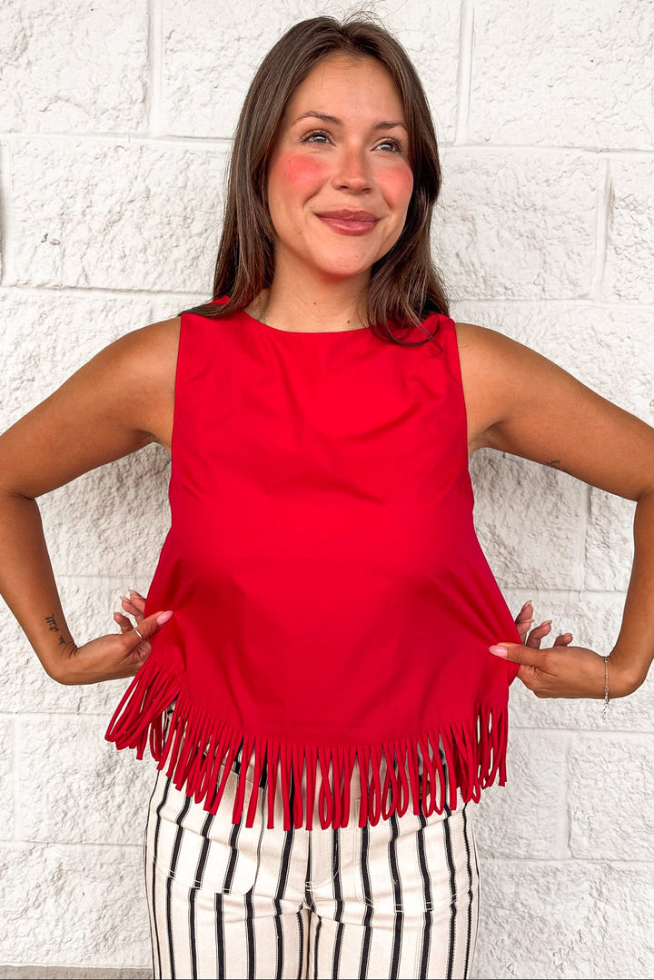 solid red fringe bottom hem crew neckline sleeveless relaxed silhouette top