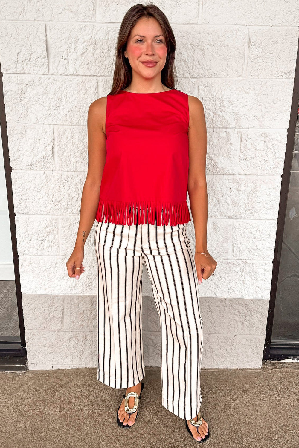 solid red fringe bottom hemline crew neckline sleeveless top