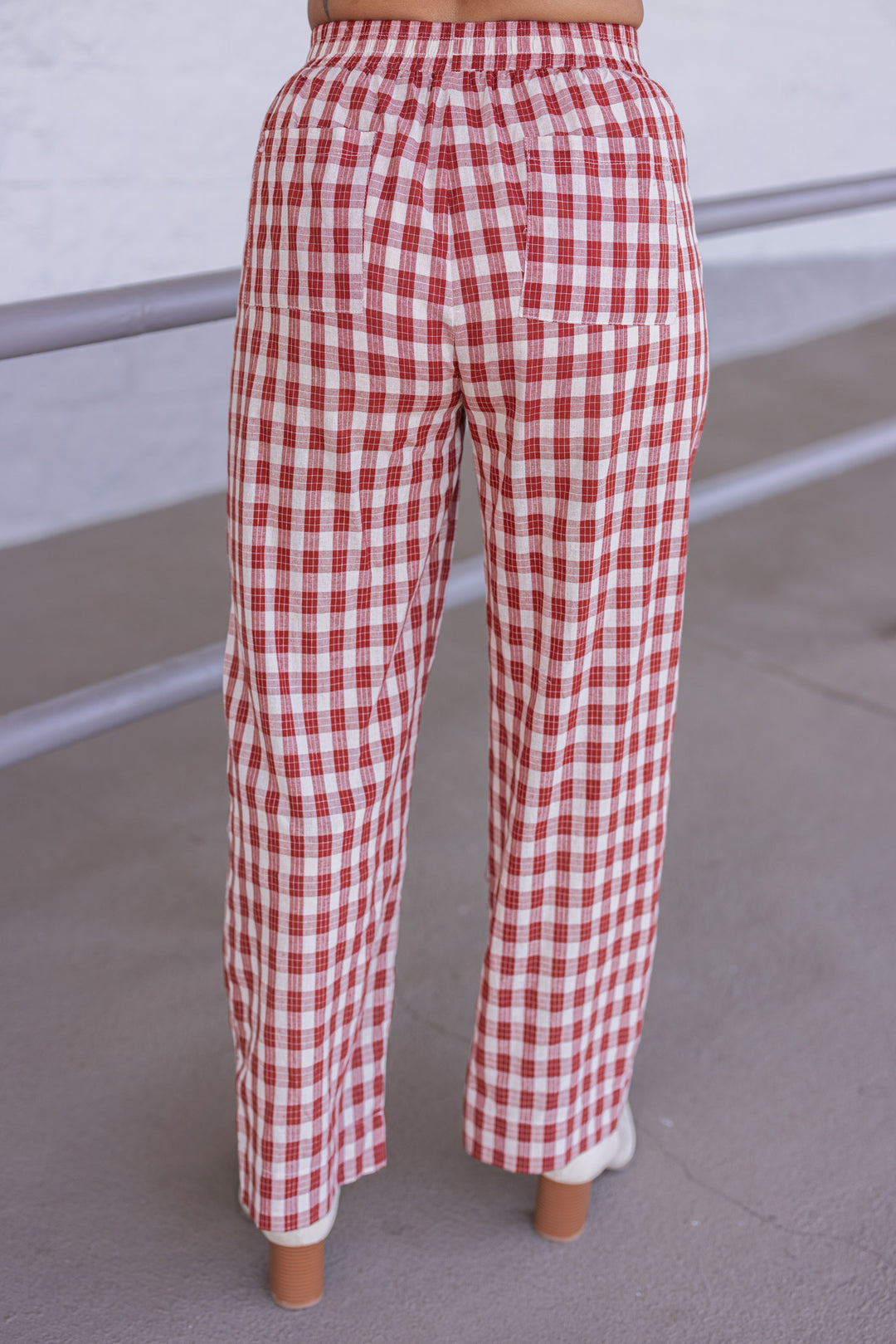 Women's rust and taupe plaid wide leg pants by Wishlist showing back view