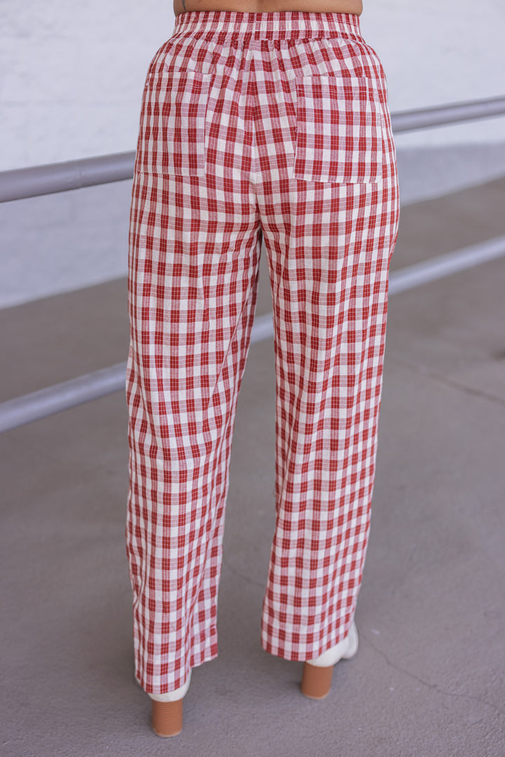 Women's rust and taupe plaid wide leg pants by Wishlist showing back view