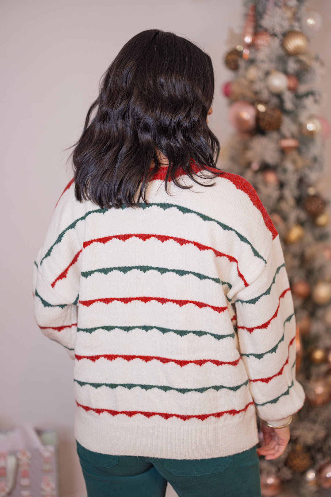 Women's ivory sweater with green and red scalloped stripes by Peach Love California showing up close back view
