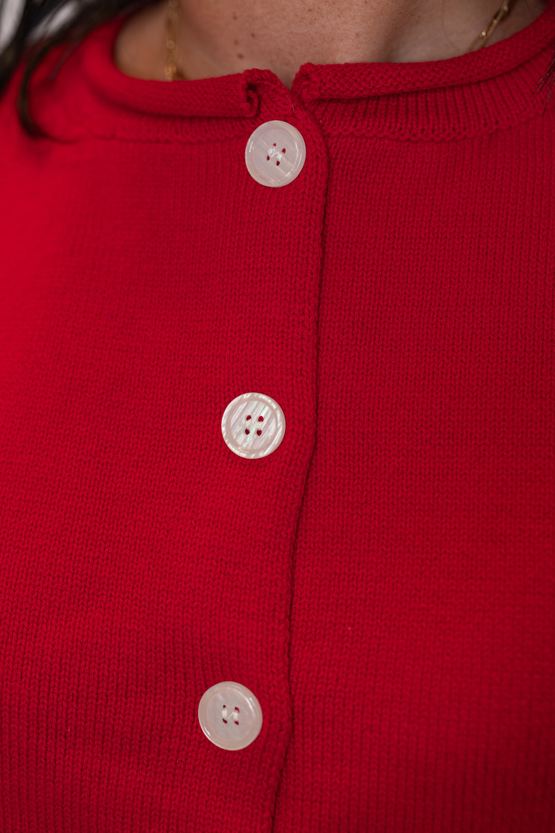 Red knit button front sleeveless sweater vest by Wishlist showing button front closure