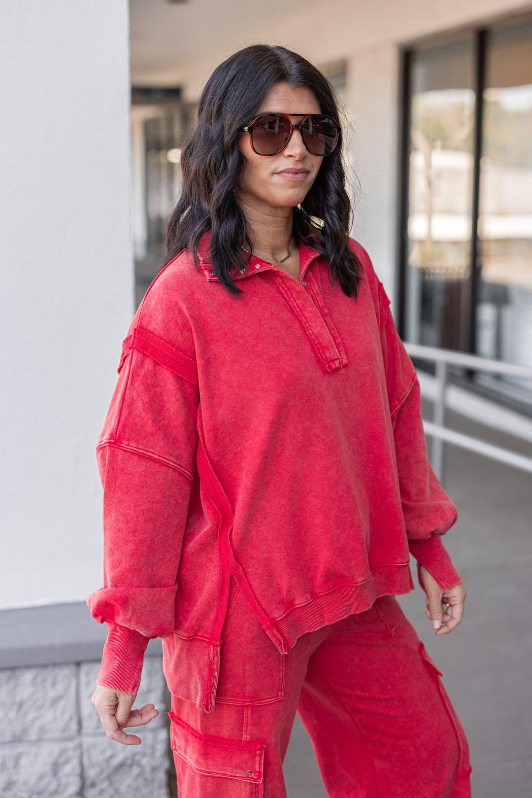 Women's washed red french terry knit pullover top with snap front bodice by ee:some showing side view
