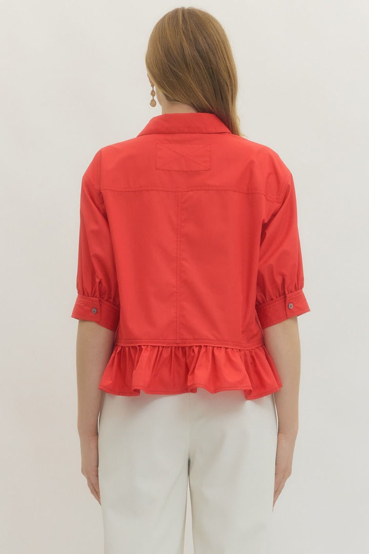 Women's semi-cropped button down red peplum top with ruffled hem by Entro showing stitch detail in back.