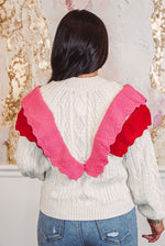 red pink ruffle sweater