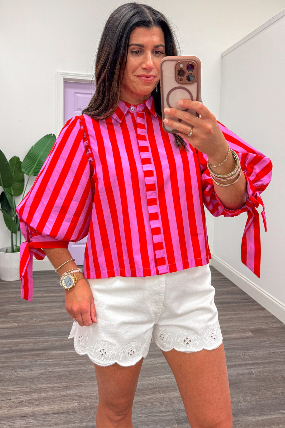 red and pink alternating striped pattern button front poplin top