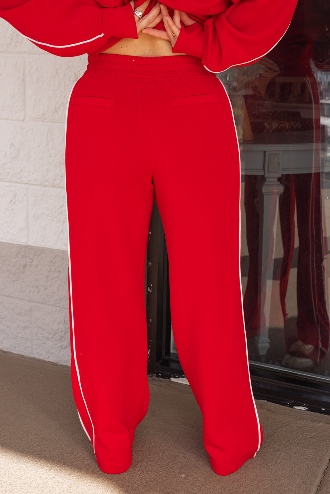 Women's red and ivory scuba knit straight leg pants by Rae Mode showing up close back view