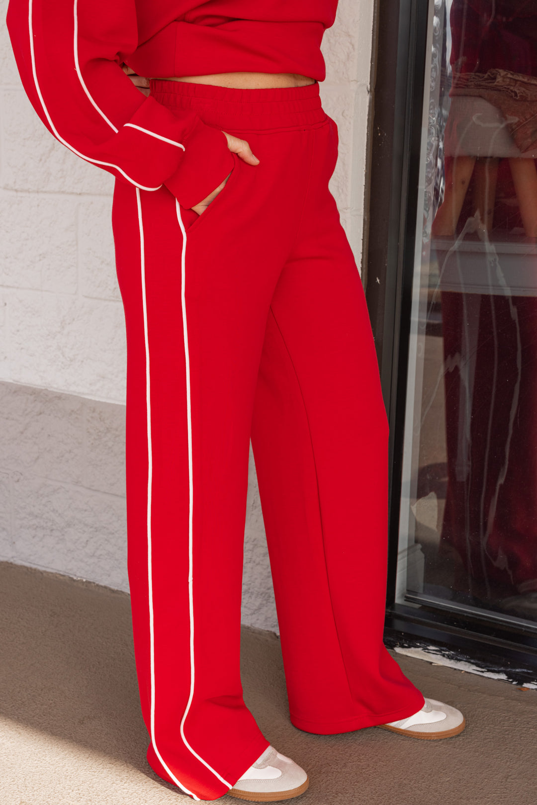 Women's red and ivory scuba knit straight leg pants by Rae Mode showing up close side view