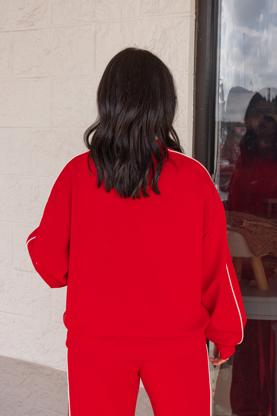 Women's red scuba knit mock neck top by Rae Mode showing up close back view