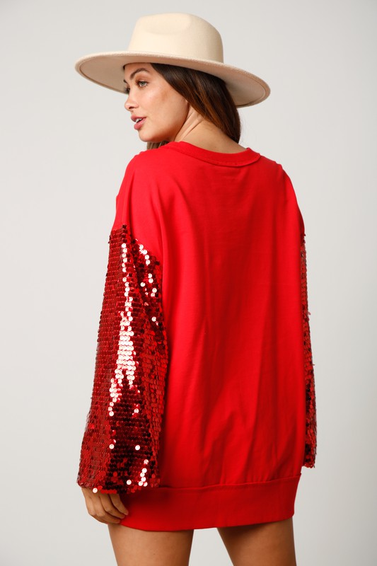 Fantastic Fawn Red terry knit pullover with red sequin sleeves