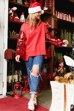 Fantastic Fawn Red terry knit pullover with red sequin sleeves