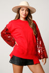 Fantastic Fawn Red terry knit pullover with red sequin sleeves