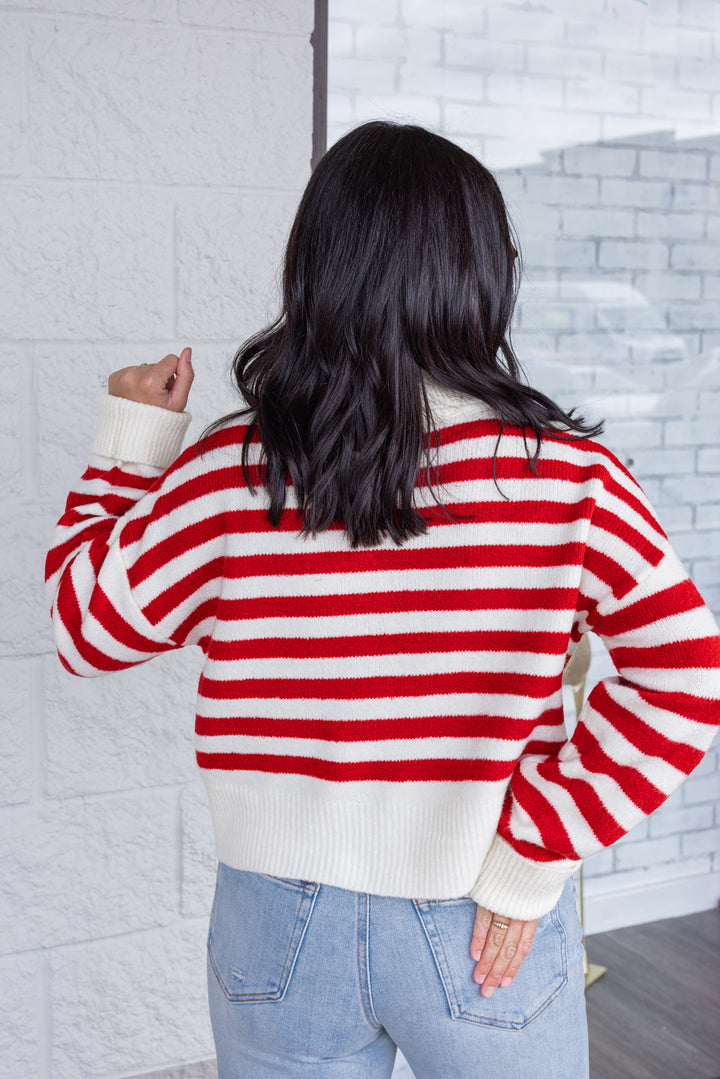 Women's red and cream striped knit cropped turtleneck sweater by hyfve showing back view