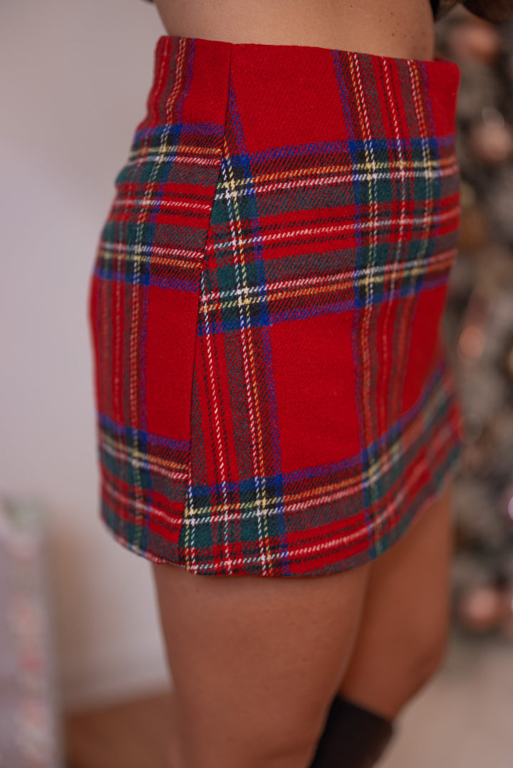 Women's red, green and navy plaid flannel skort with slit in hem by Day + Moon showing up close side view