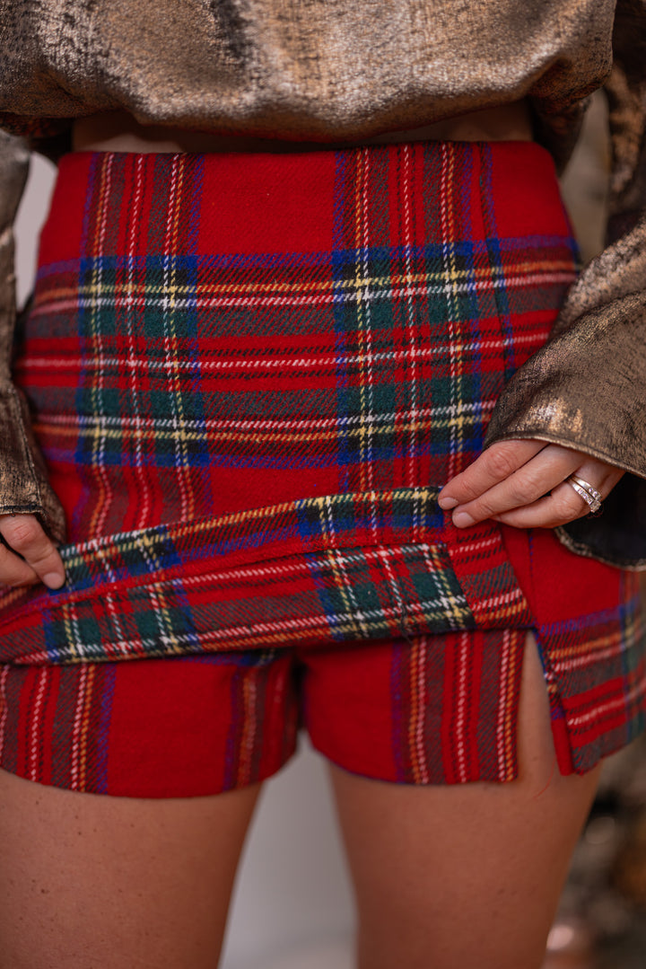 Women's red, green and navy plaid flannel skort with slit in hem by Day + Moon showing shorts underneath