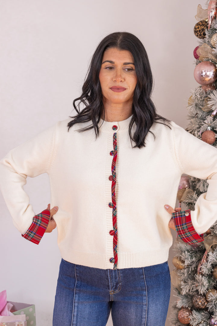 Women's cream button front sweater knit cardigan with contrasting red plaid trim by Entro showing true to size fit