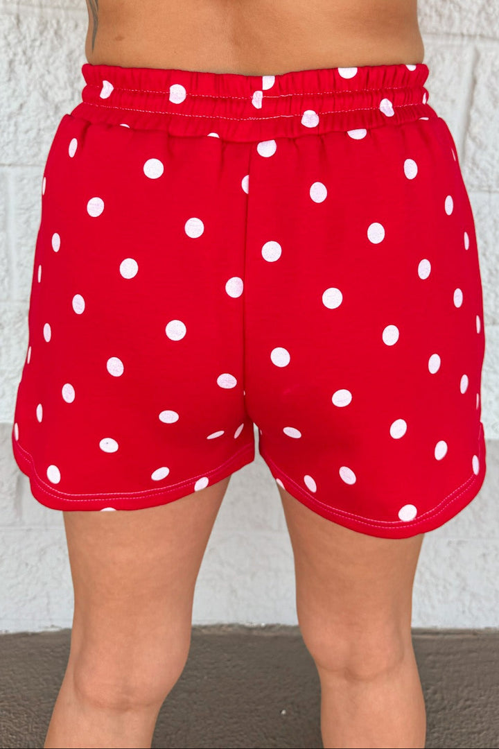 red with white polka dot print top and wide leg shorts matching knit athleisure set