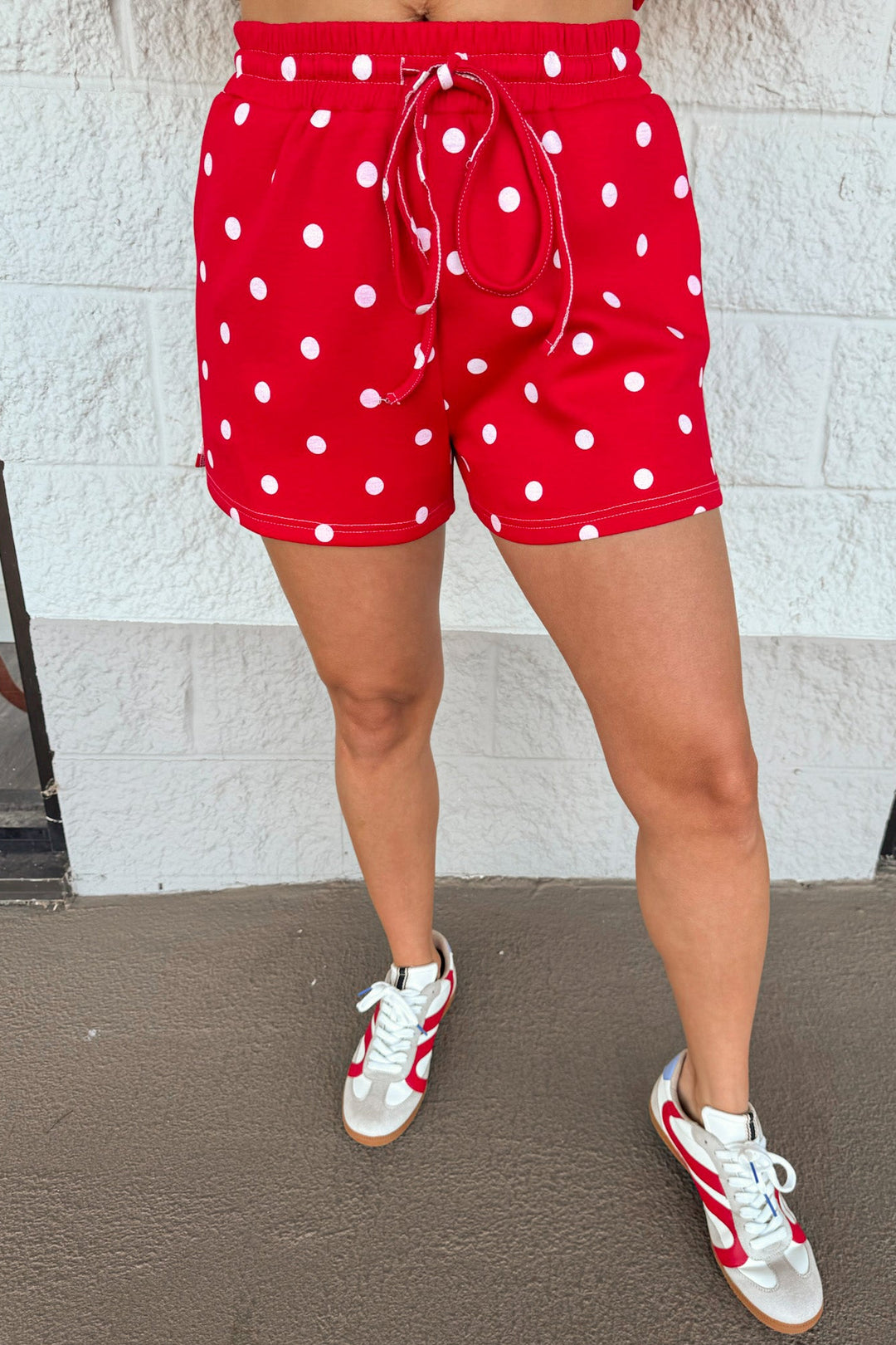 red with white polka dot print top and drawstring elastic waist shorts matching knit athleisure set