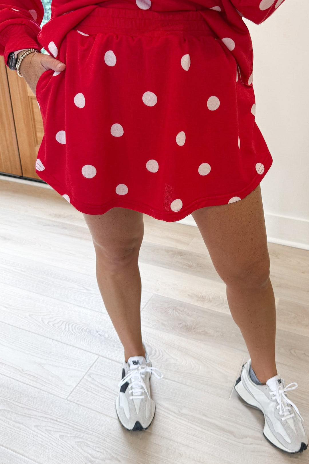red with white polka dot print top and rounded hem skort matching terry cotton knit set