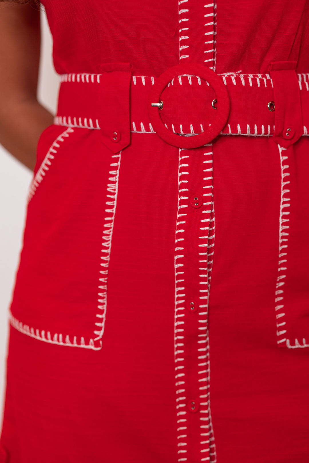 Women's red button down dress with belted waist and cream stitching trim by Entro showing removable belt and cream stitch details