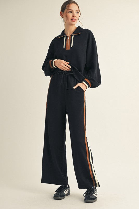 Women's black scuba knit quarter zip pullover with contrasting ribbed colorblock trim by Jodifl showing full front view