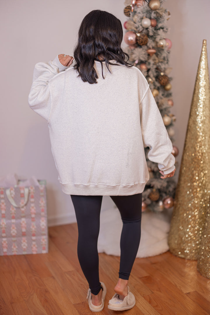 Women's reversible sweatshirt with "Grinchy" on grey or "Naughty" on white by BucketList showing full back view