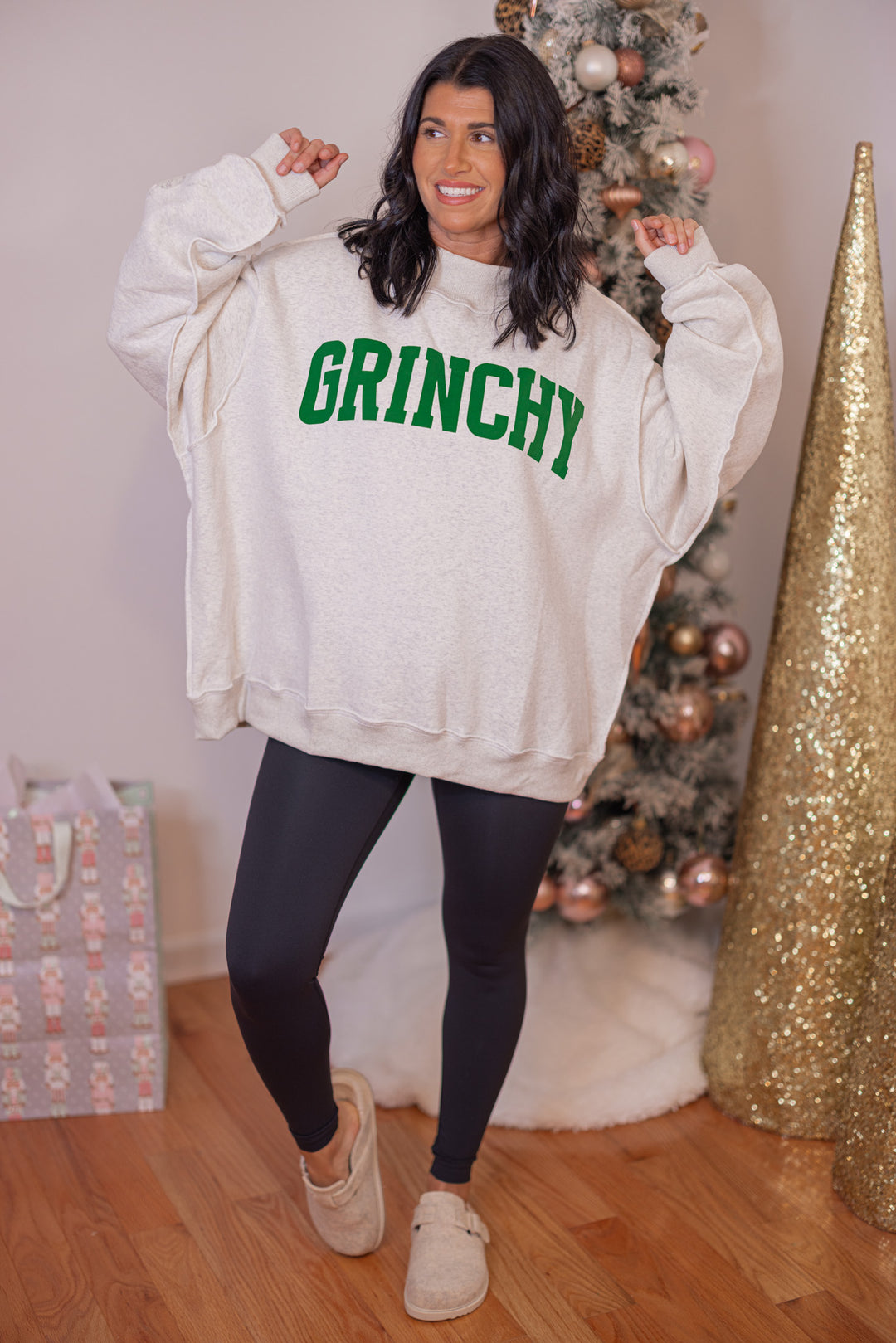 Women's reversible sweatshirt with "Grinchy" on grey or "Naughty" on white by BucketList showing "grinchy" full front view