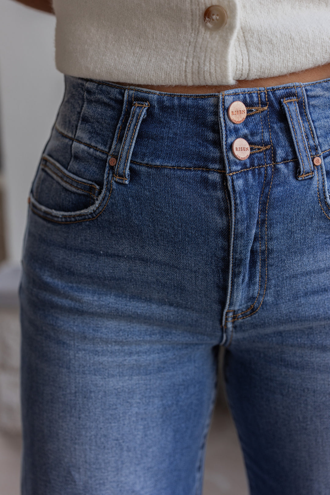 Risen Jeans dark wash denim jeans with wide ankle seam detail showing up close front view