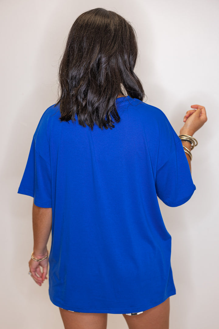 Women's royal blue lightweight top with embossed 'Go Team' in center by Jess Lea showing up close back view