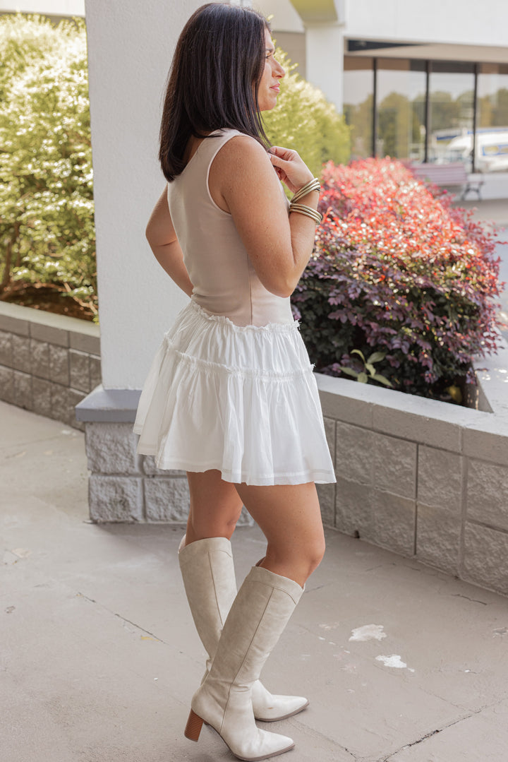 Women's sleeveless dress with champagne knit top and white ruffle tiered poplin skirt by Wishlist showing full side view