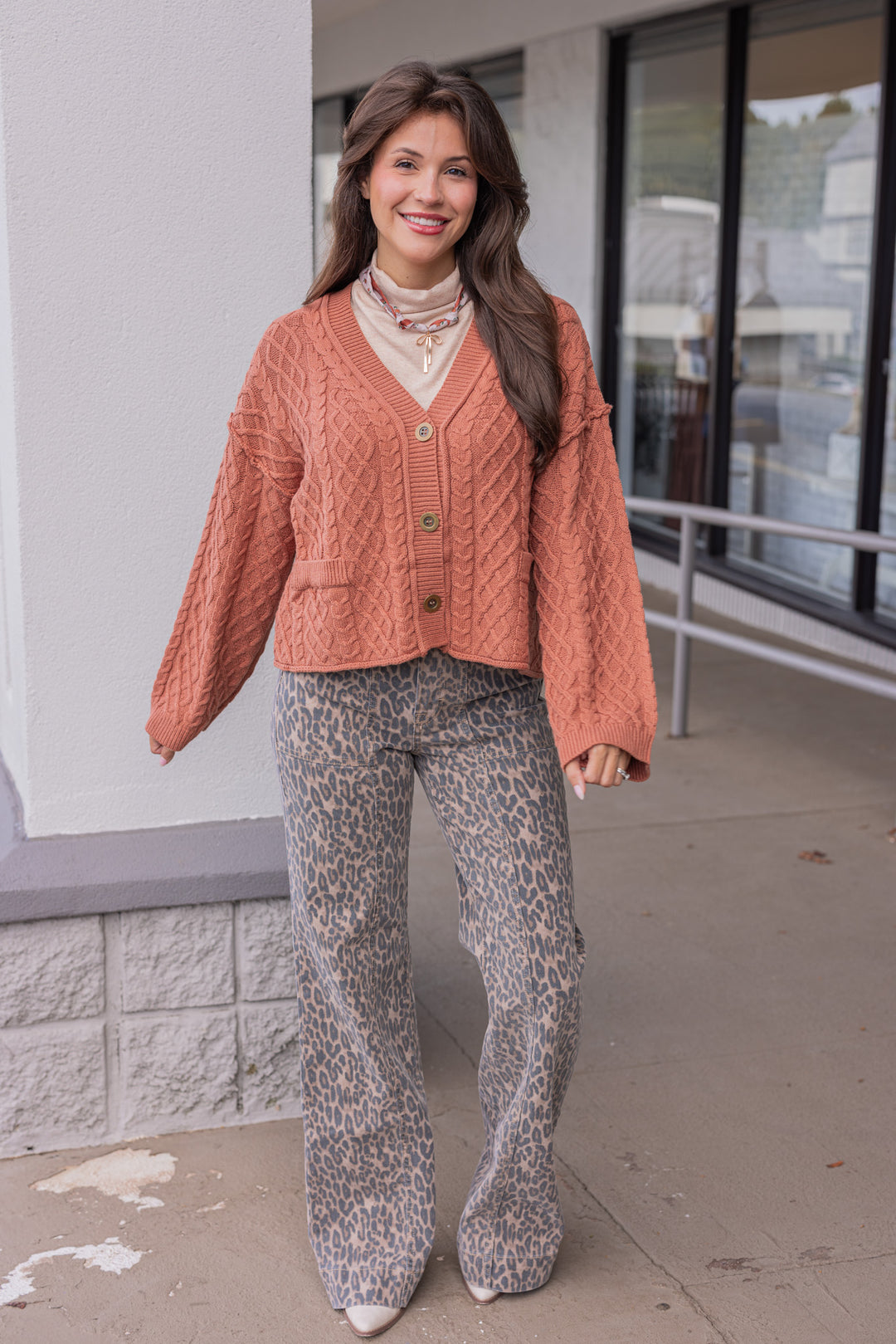 Women's terra cotta cable knit sweater cardigan by Entro showing full front view