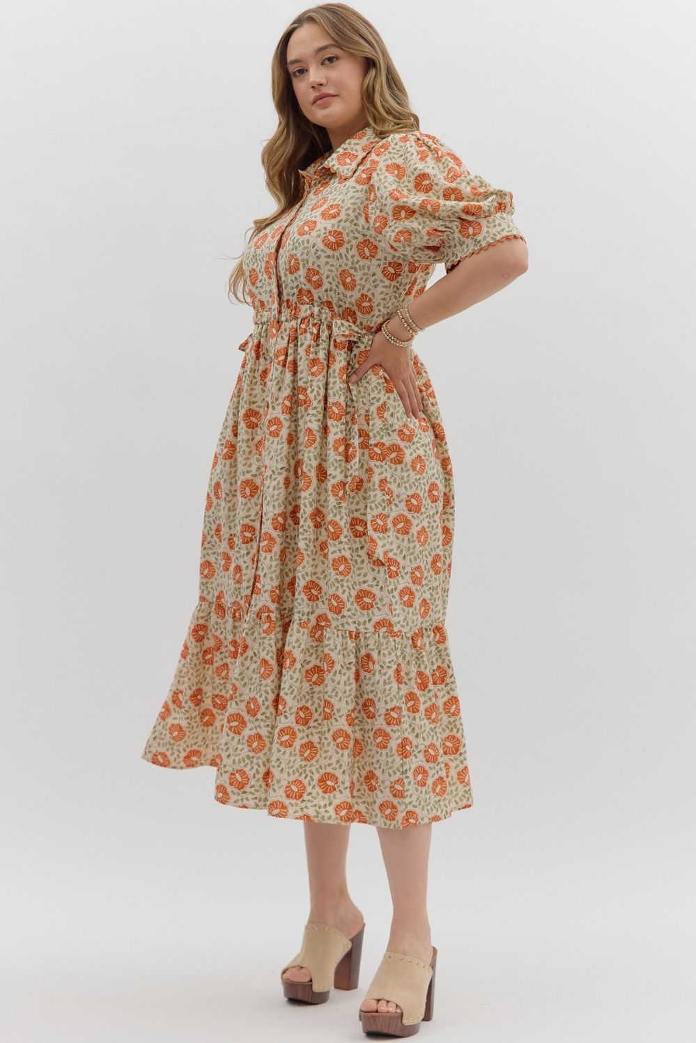 Women's plus size cream button front midi dress with rust floral print by Entro showing tiered skirt detailing