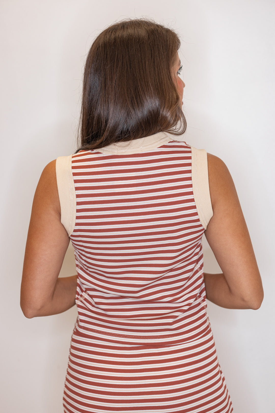 Women's textured knit rust and taupe striped midi skirt with matching top by Wishlist showing back view of top