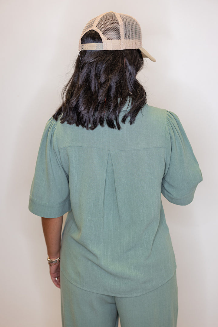 Women's sage green linen bow tie top and elastic waist wide leg pants set by Jodifl showing up close back view of top