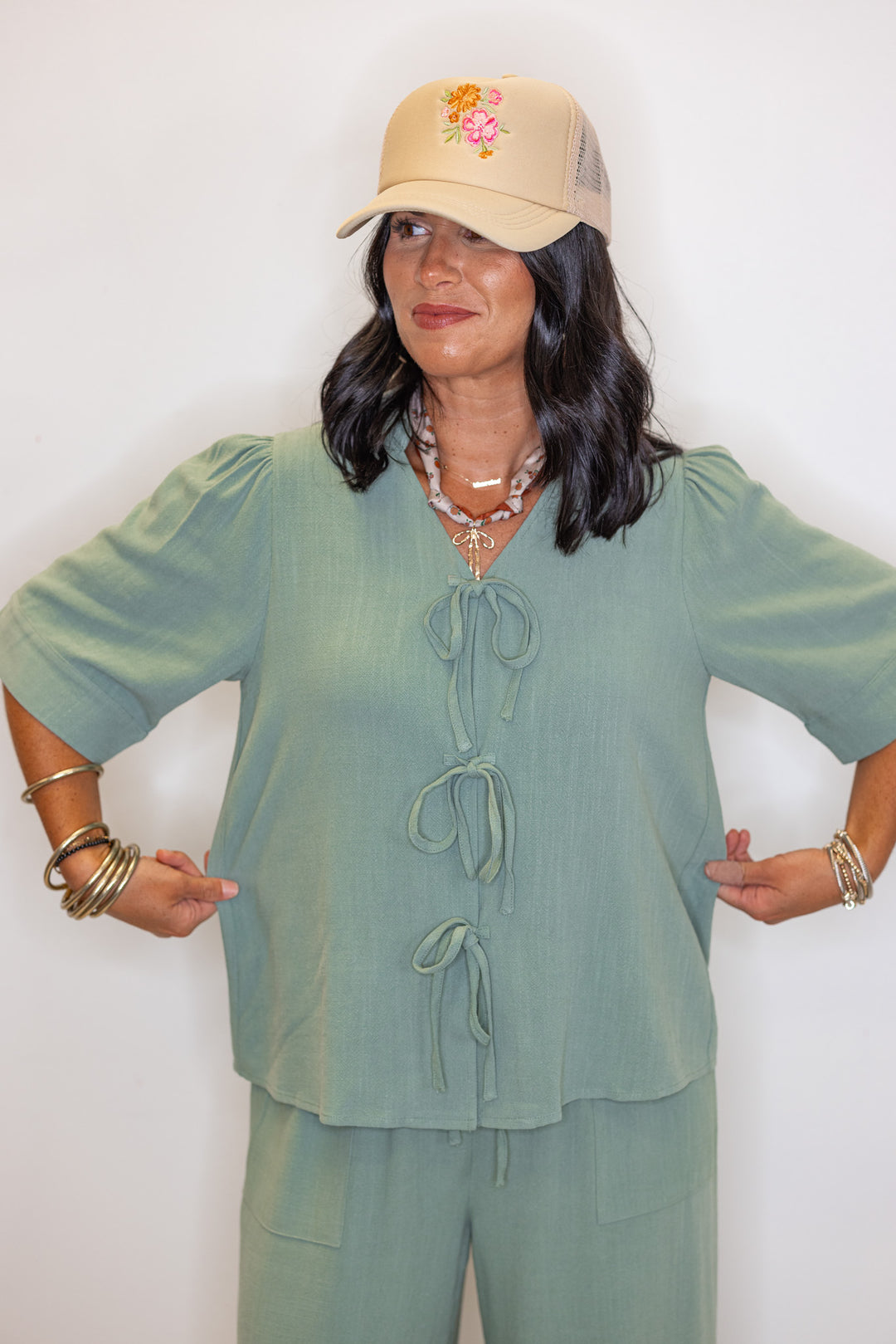 Women's sage green linen bow tie top and elastic waist wide leg pants set by Jodifl showing tops true to size fit