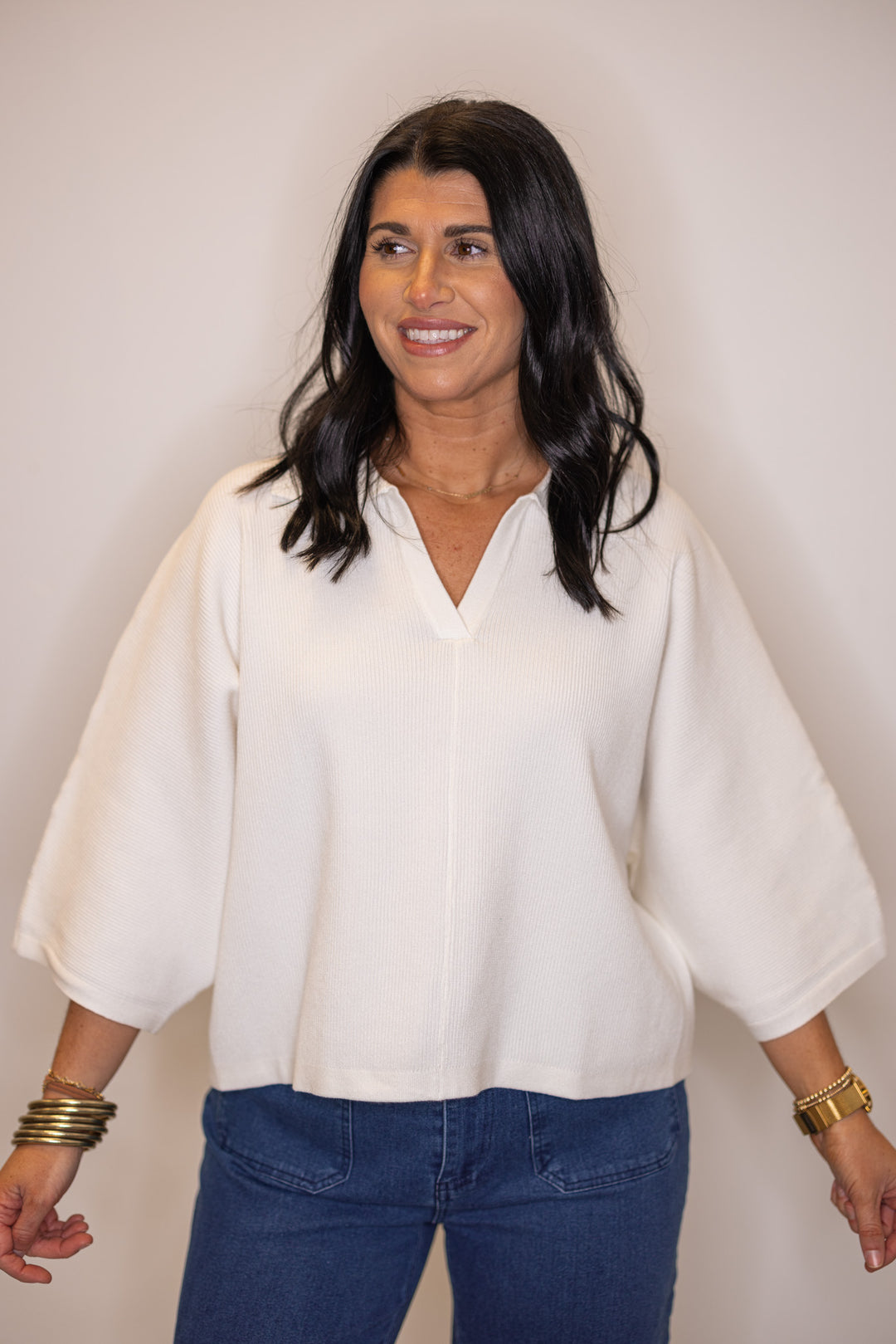 Women's off white ribbed knit top with a collar by Entro