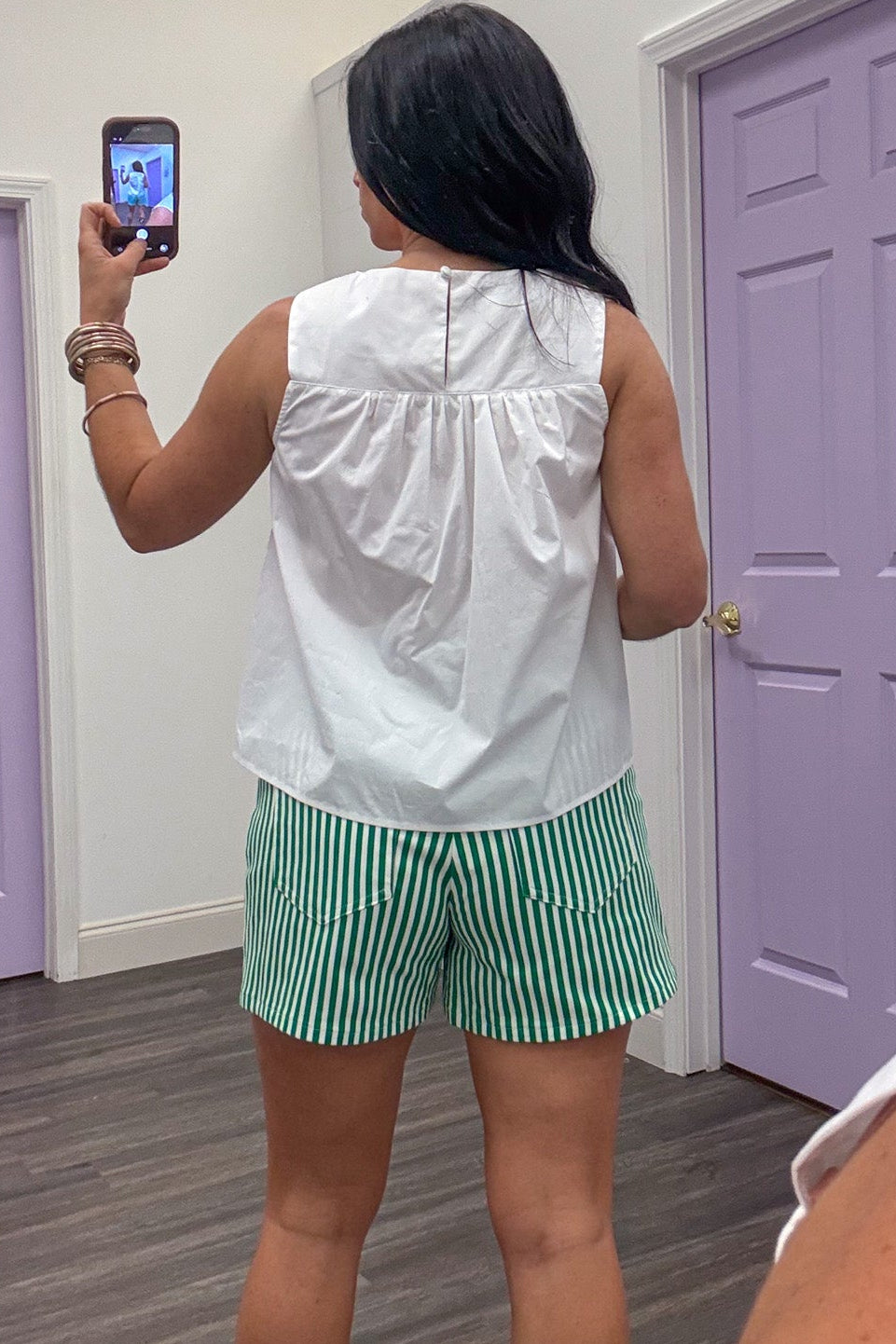 solid white sleeveless cotton top with back keyhole button closure