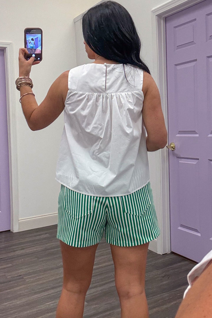 solid white sleeveless cotton top with back keyhole button closure