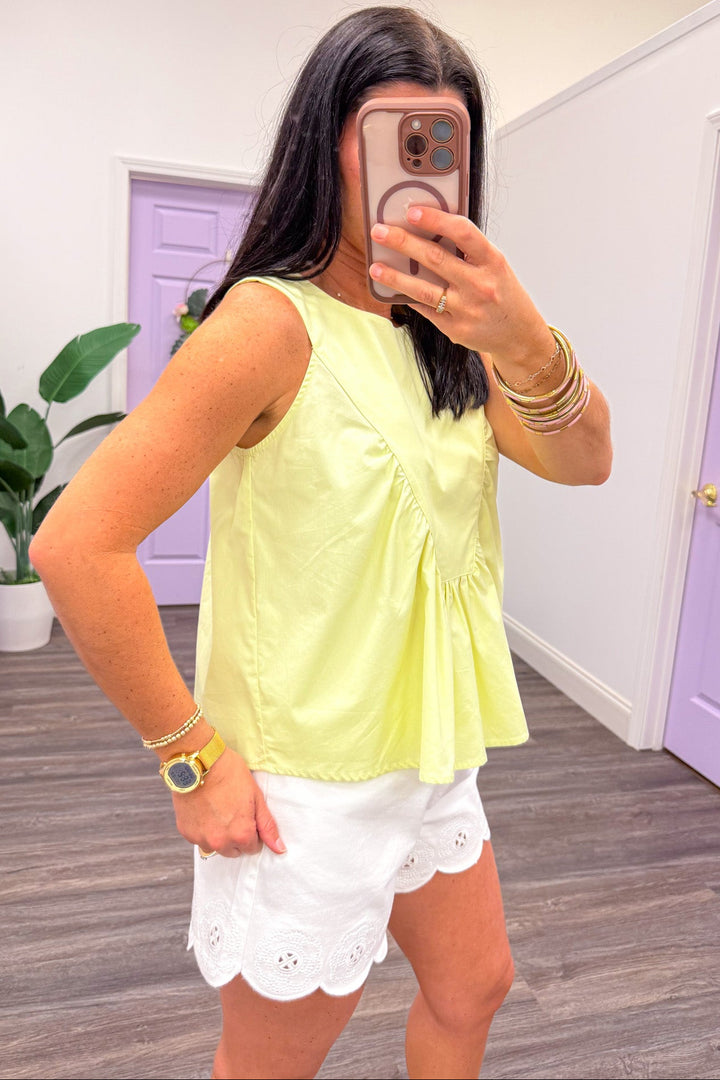 solid pale yellow sleeveless cotton top with crew neckline