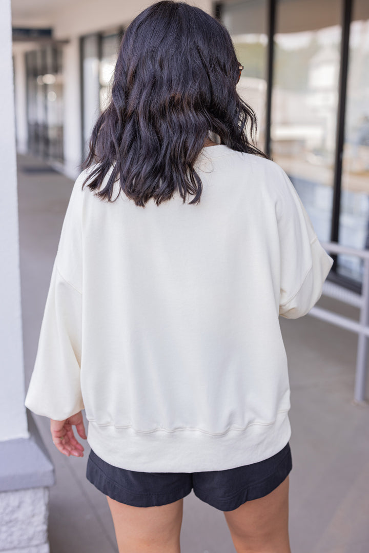 Women's cream sweatshirt with "Spooky" in lace ghosts and black checkered print by Peach Love California showing up close back view