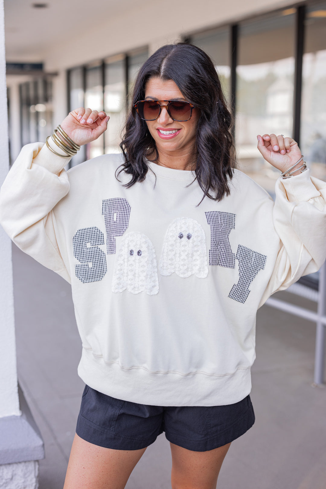 Women's cream sweatshirt with "Spooky" in lace ghosts and black checkered print by Peach Love California