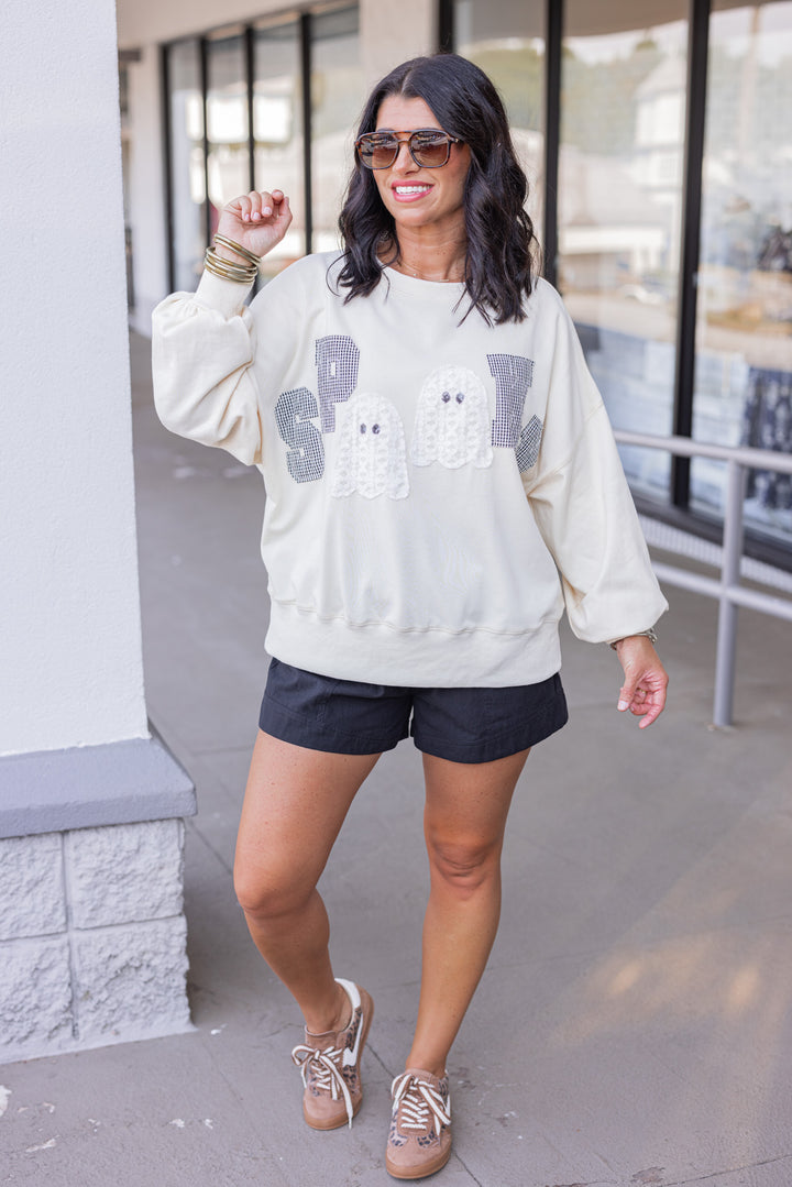 Women's cream sweatshirt with "Spooky" in lace ghosts and black checkered print by Peach Love California showing full front view